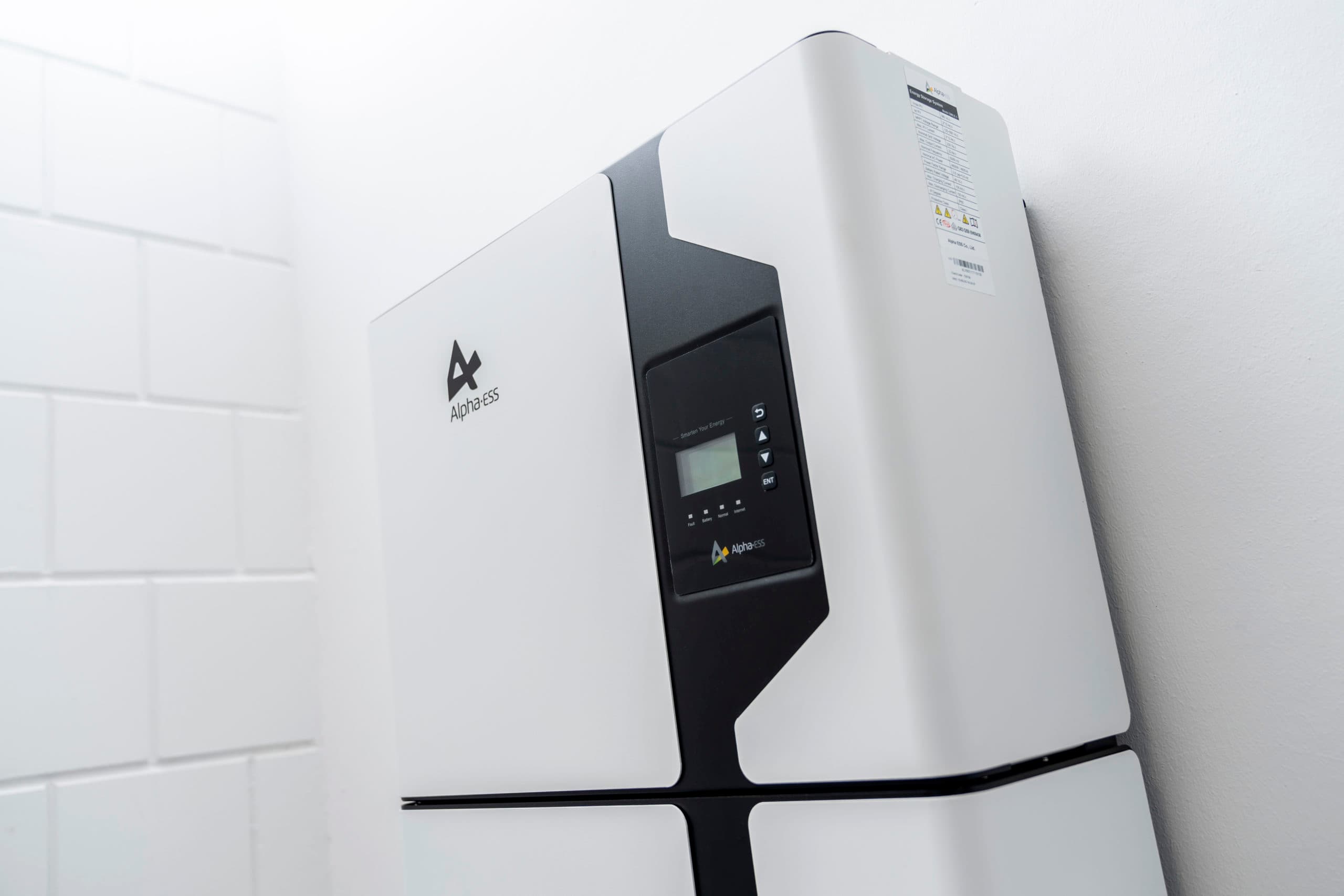 Alpha ESS Solar Battery SMILE 5 on a white wall.
