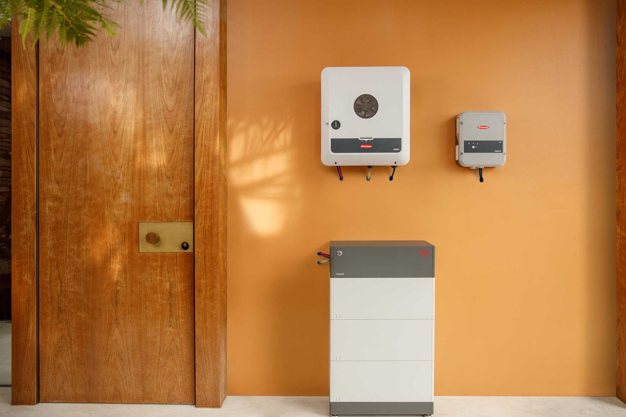 Fronius GEN24 hybrid inverter pictured with a BYD battery in a classic home representing the proposed WA solar battery rebate/Residential Battery Scheme.
