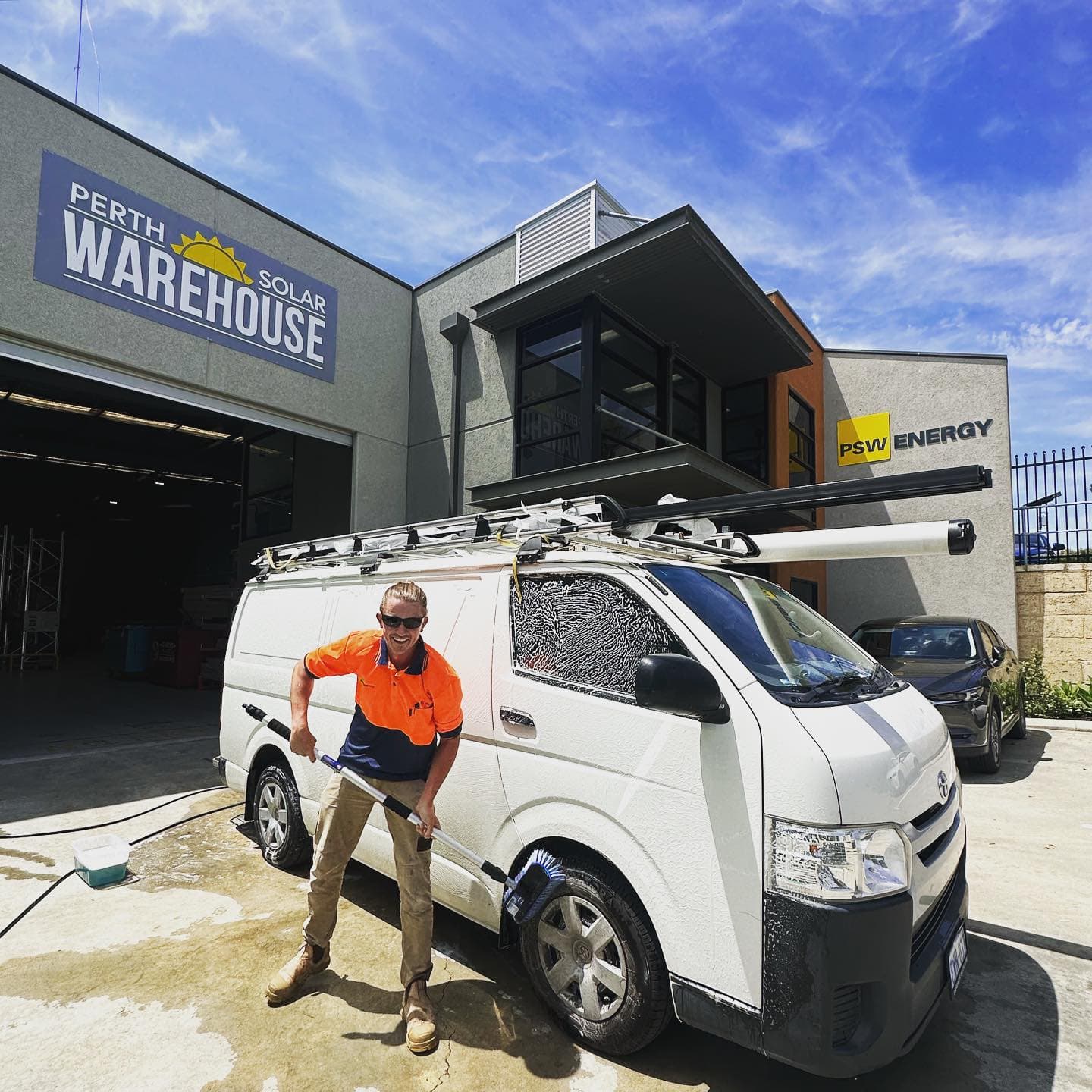Perth Solar Warehouse technician washing a van