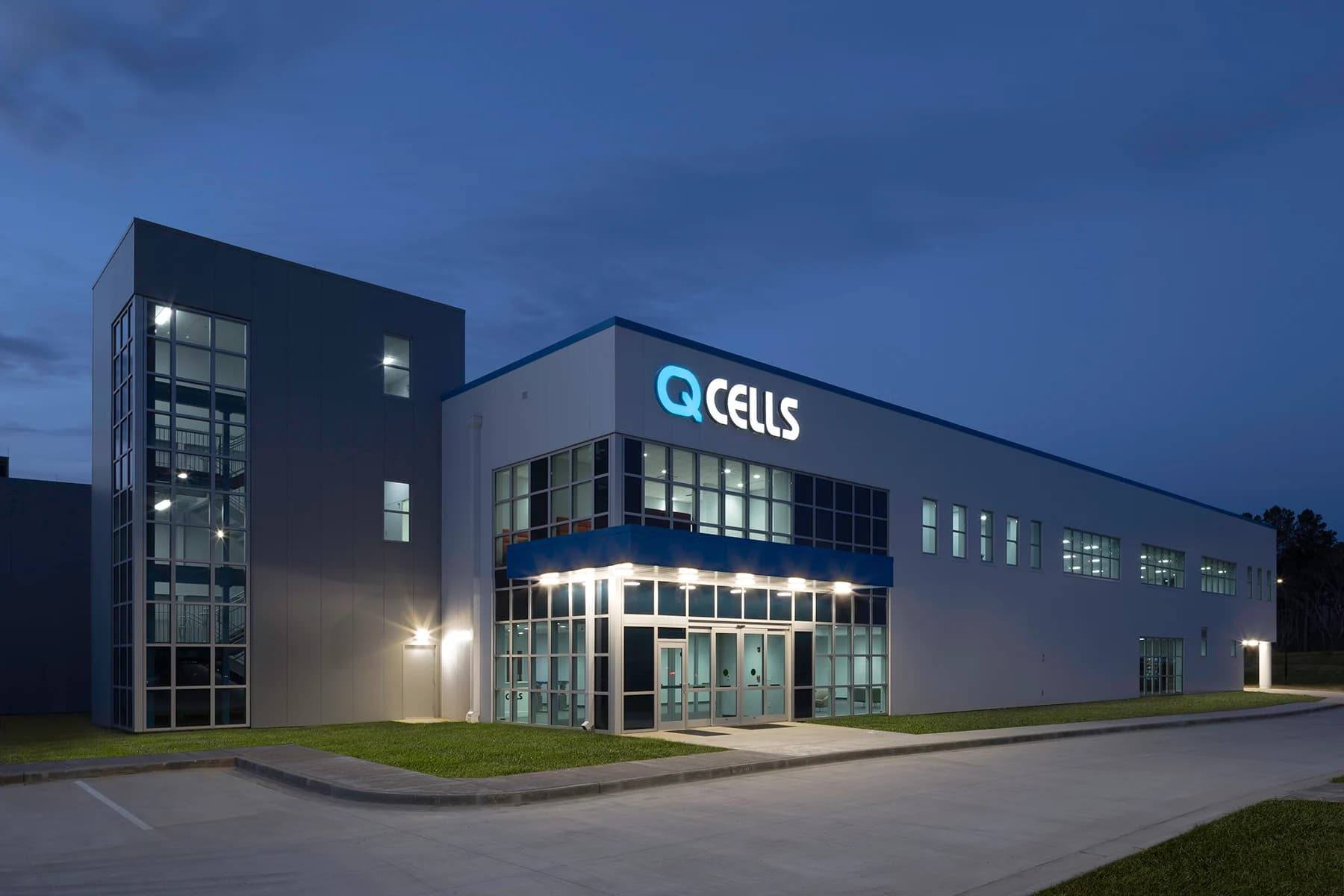 QCells facility with half lights on at dusk for QCells solar panels Perth updating Australia exit